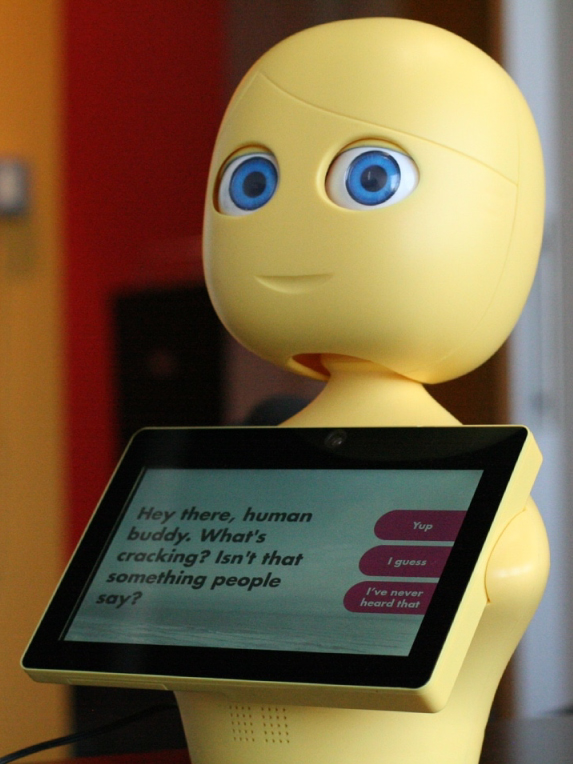 A yellow robot with a tablet